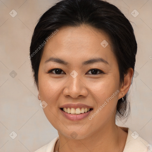 Joyful asian young-adult female with medium  brown hair and brown eyes