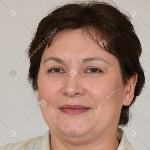 Joyful white adult female with medium  brown hair and brown eyes