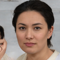 Neutral asian young-adult female with medium  brown hair and brown eyes