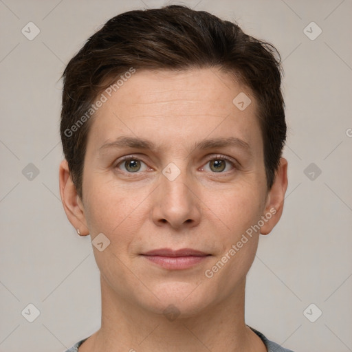 Joyful white young-adult female with short  brown hair and grey eyes