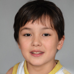 Joyful white child female with short  brown hair and brown eyes