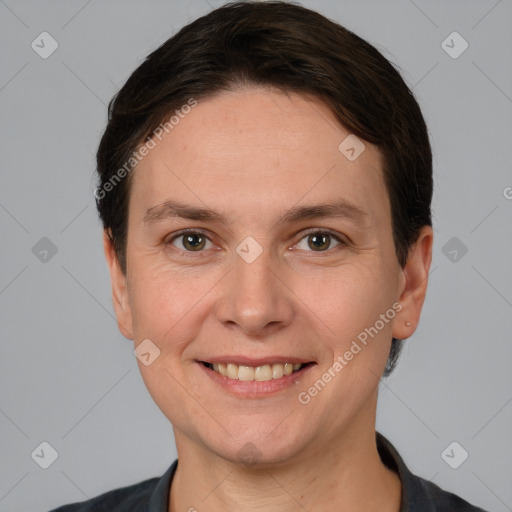 Joyful white adult female with short  brown hair and brown eyes