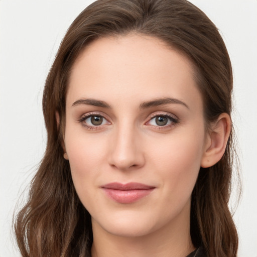 Joyful white young-adult female with long  brown hair and blue eyes