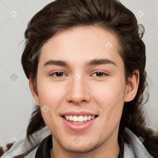 Joyful white young-adult male with medium  brown hair and brown eyes