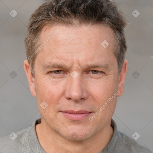 Joyful white adult male with short  brown hair and grey eyes