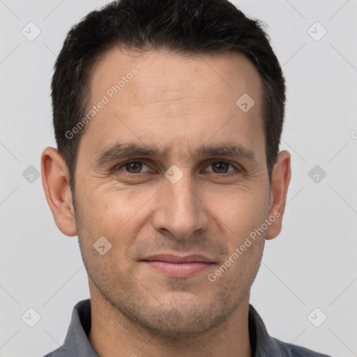 Joyful white adult male with short  brown hair and brown eyes