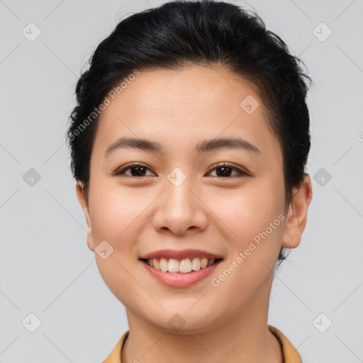 Joyful asian young-adult female with short  brown hair and brown eyes