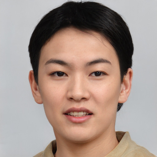 Joyful asian young-adult female with short  black hair and brown eyes