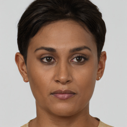 Joyful asian young-adult female with short  brown hair and brown eyes