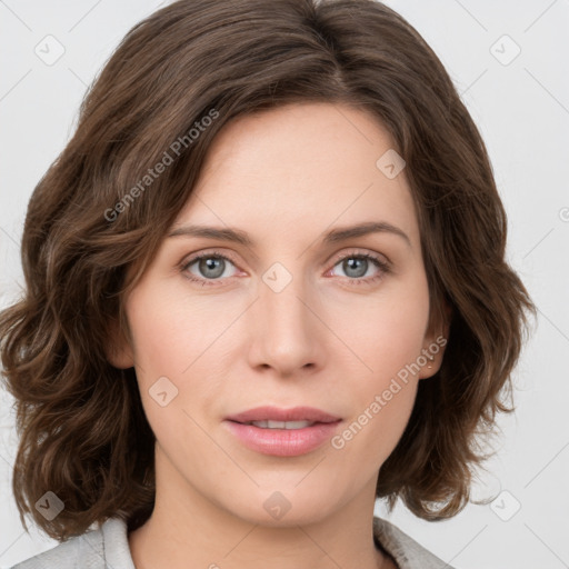 Joyful white young-adult female with medium  brown hair and green eyes