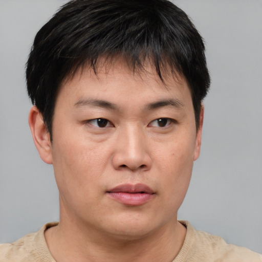 Neutral asian young-adult male with short  brown hair and brown eyes