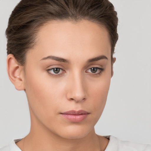 Neutral white young-adult female with short  brown hair and brown eyes