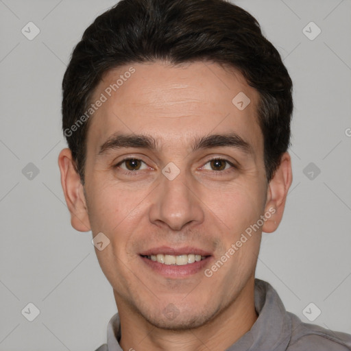 Joyful white adult male with short  black hair and brown eyes