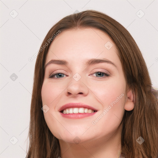 Joyful white young-adult female with long  brown hair and blue eyes