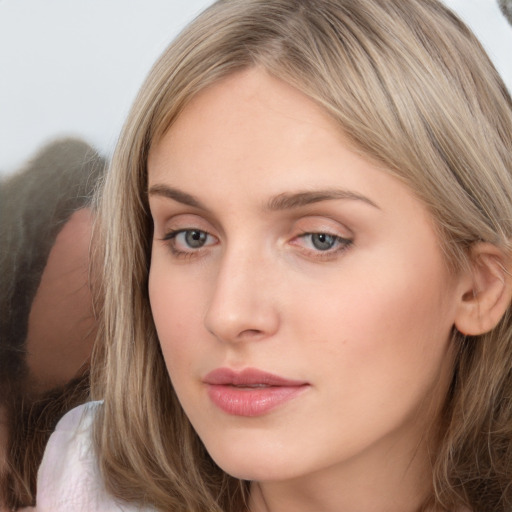 Neutral white young-adult female with long  brown hair and grey eyes