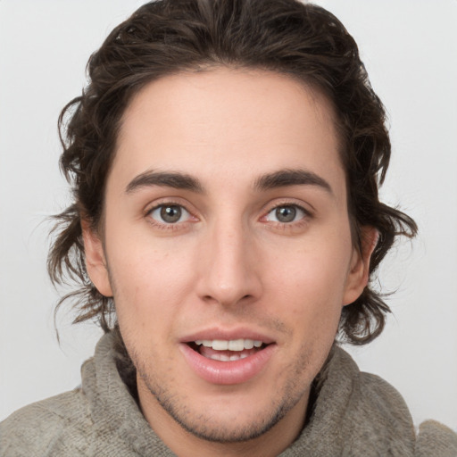 Joyful white young-adult male with medium  brown hair and brown eyes