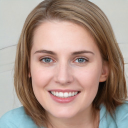 Joyful white young-adult female with medium  brown hair and blue eyes