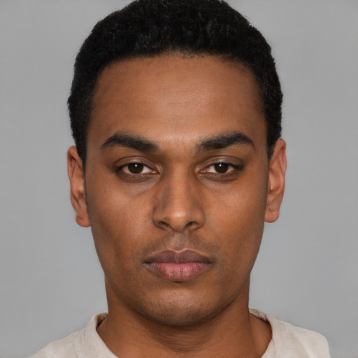 Neutral latino young-adult male with short  black hair and brown eyes