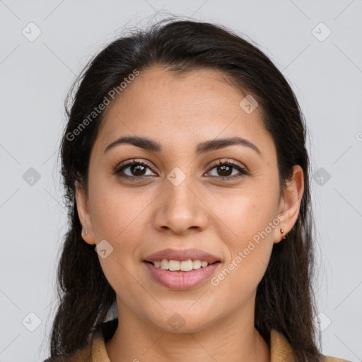 Joyful latino young-adult female with long  brown hair and brown eyes