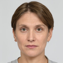 Joyful white adult female with short  brown hair and grey eyes