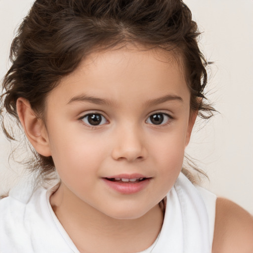 Joyful white child female with medium  brown hair and brown eyes