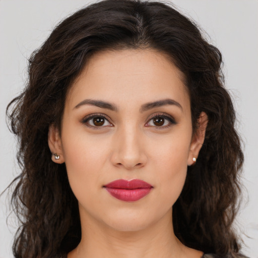 Joyful white young-adult female with long  brown hair and brown eyes