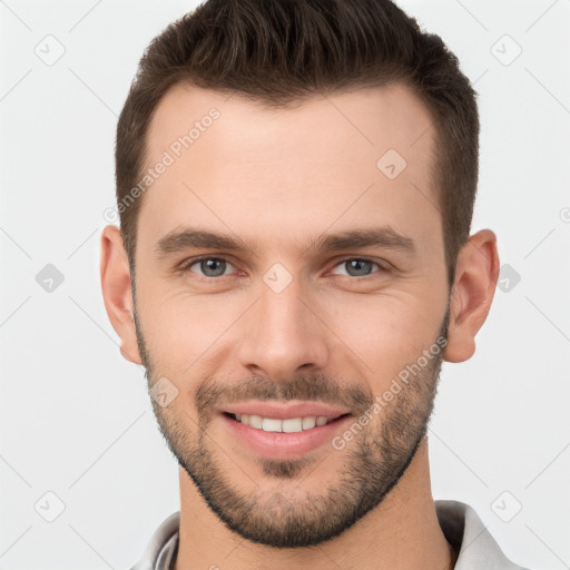 Joyful white young-adult male with short  brown hair and brown eyes