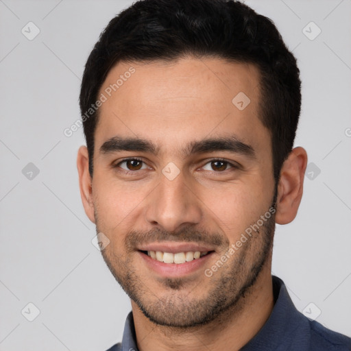 Joyful white young-adult male with short  black hair and brown eyes