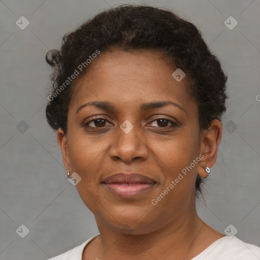 Joyful black adult female with short  brown hair and brown eyes