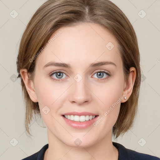 Joyful white young-adult female with medium  brown hair and blue eyes