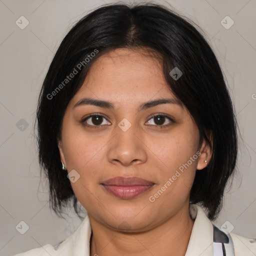 Joyful latino young-adult female with medium  brown hair and brown eyes