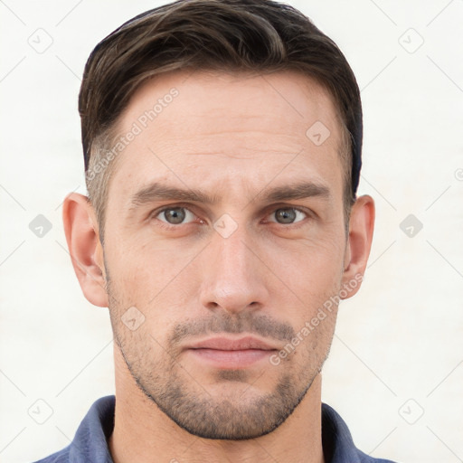 Neutral white young-adult male with short  brown hair and grey eyes