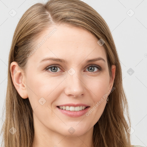 Joyful white young-adult female with long  brown hair and grey eyes