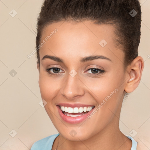 Joyful white young-adult female with short  brown hair and brown eyes