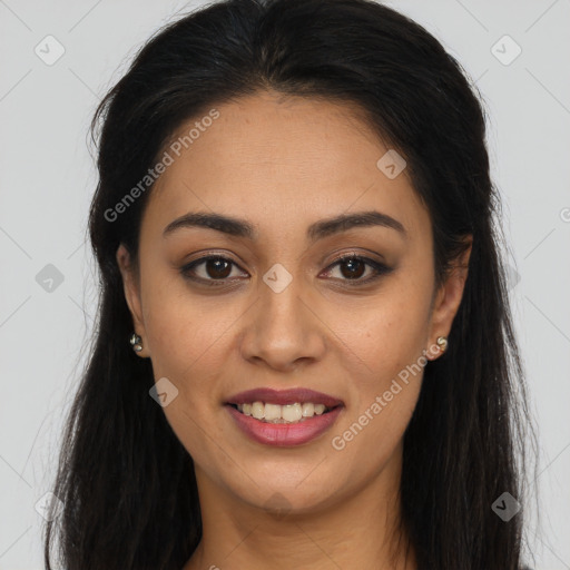 Joyful latino young-adult female with long  brown hair and brown eyes