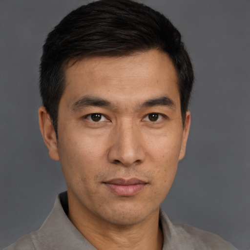 Neutral asian young-adult male with short  brown hair and brown eyes