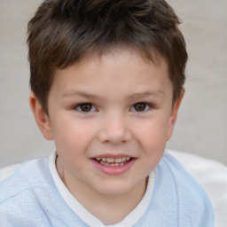 Joyful white child male with short  brown hair and brown eyes