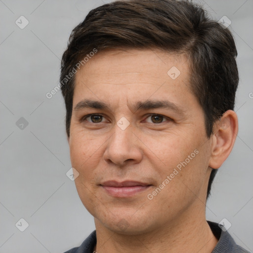 Joyful white adult male with short  brown hair and brown eyes