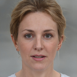 Joyful white adult female with short  brown hair and grey eyes