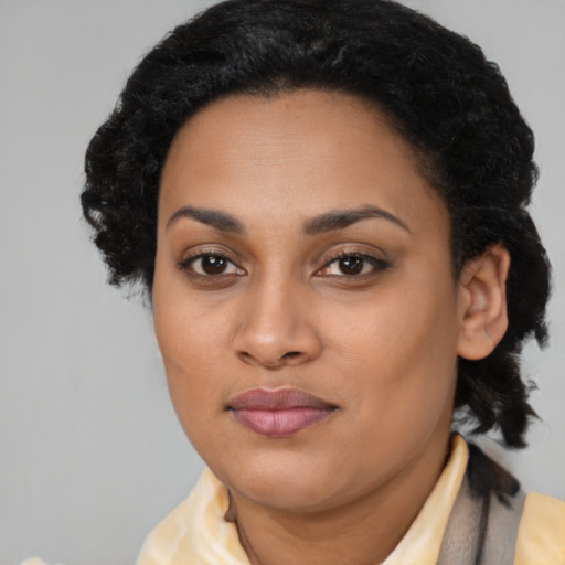 Joyful latino young-adult female with medium  black hair and brown eyes