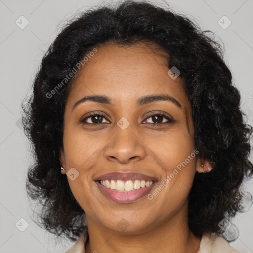 Joyful black adult female with medium  brown hair and brown eyes