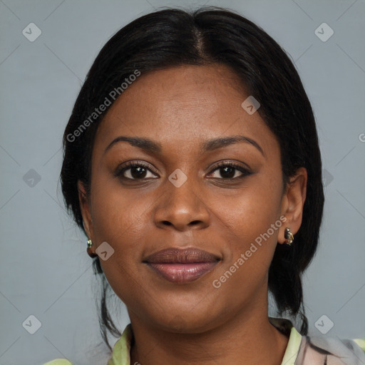 Joyful black adult female with medium  brown hair and brown eyes