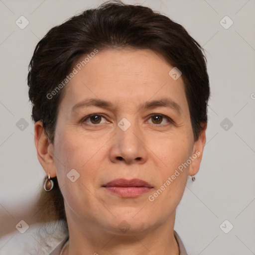 Joyful white adult female with short  brown hair and brown eyes