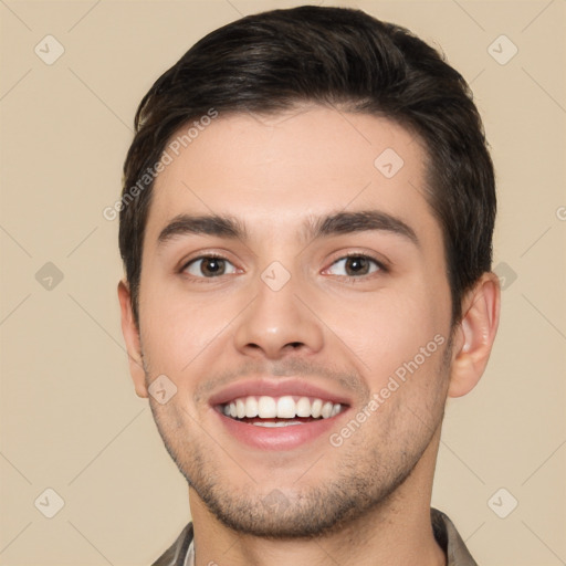 Joyful white young-adult male with short  brown hair and brown eyes