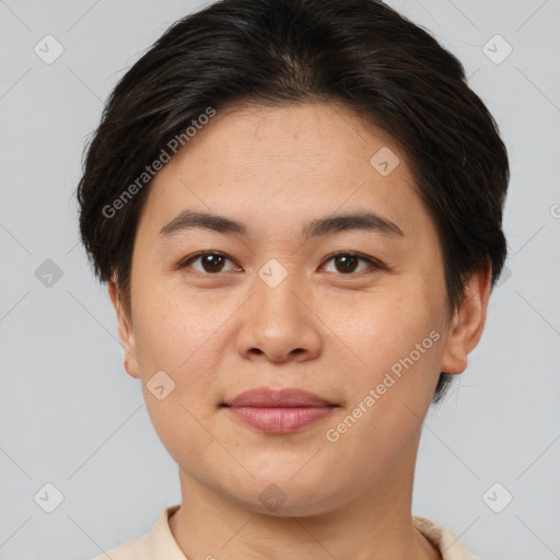 Joyful asian young-adult female with short  brown hair and brown eyes