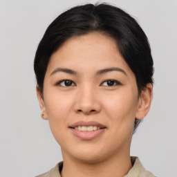 Joyful asian young-adult female with short  brown hair and brown eyes