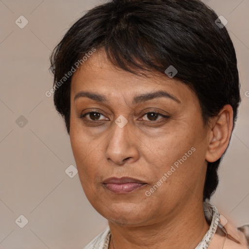 Joyful white adult female with medium  brown hair and brown eyes