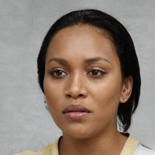 Neutral black young-adult female with medium  black hair and brown eyes
