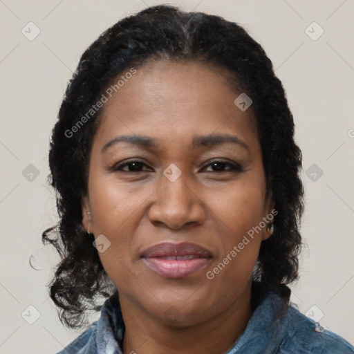 Joyful black adult female with medium  brown hair and brown eyes