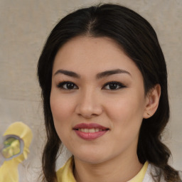 Joyful asian young-adult female with medium  brown hair and brown eyes